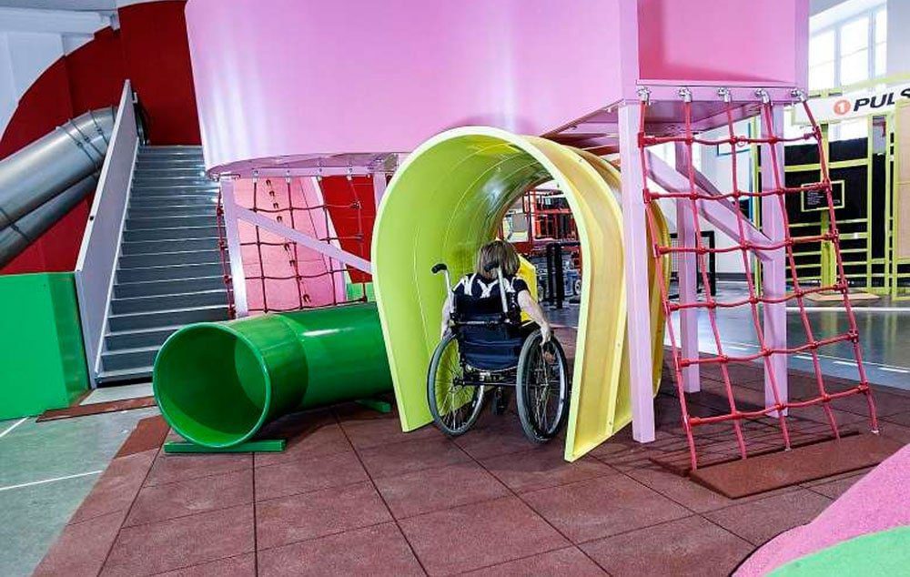 A young wheelchair user taking part in an obstacle course at the MegaMind science centre in Sweden's National Museum of Science and Technology