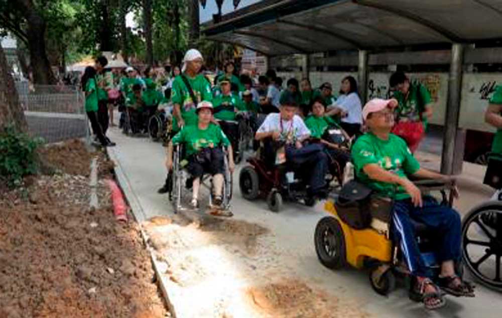 Stumbling block. Members of Seacat 2012 venturing out on the streets of Kuala Lumpur to check some of the sights in the city. Poor accessibility for the disabled deters tourists from visiting our country. — Chin Mui Yoon