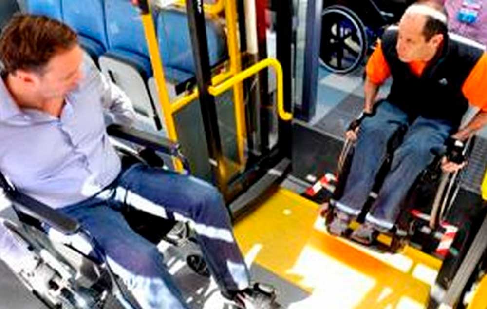 Disability consultant Jacques Lloyd shows councillor Brett Herron, left, how difficult it is to get into a MyCiTi bus while in a wheelchair