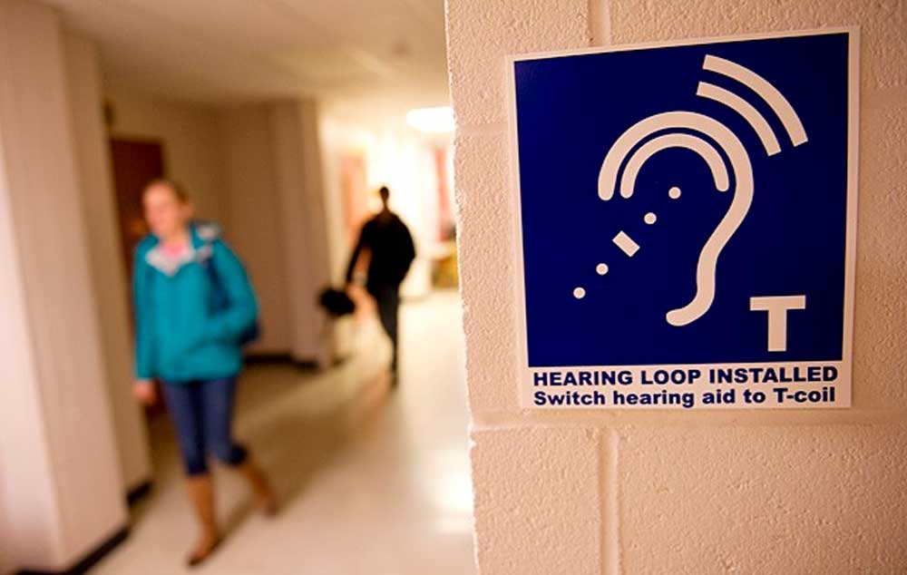 Symbol informs: Hearing Loop Installed. Switch hearing aid to T-coil.