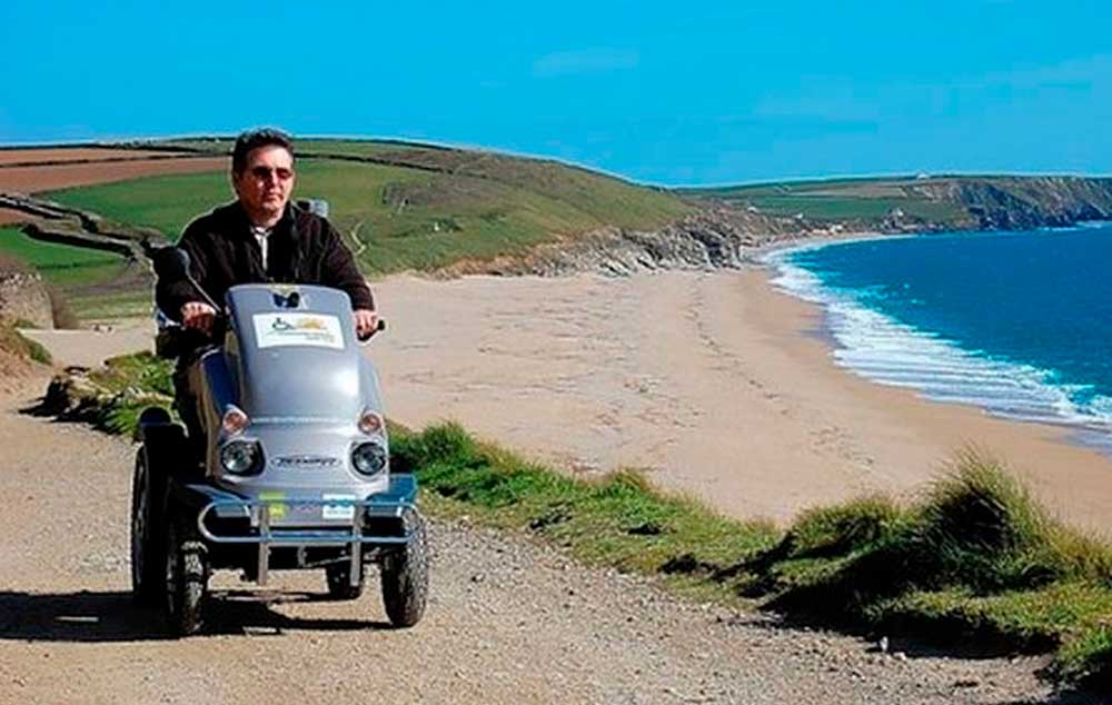 A Countryside Mobility beach buggy being used on the National Trust's Penrose Estate in Cornwall