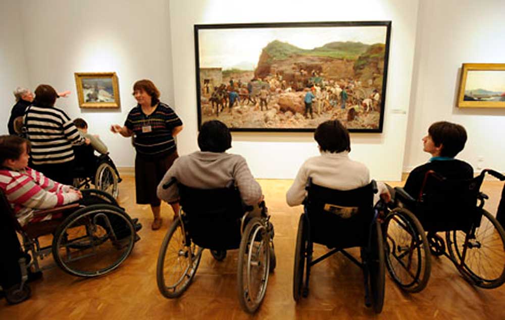 Visitors in wheelchairs at the State Museum of Russia during Day of the Handicapped