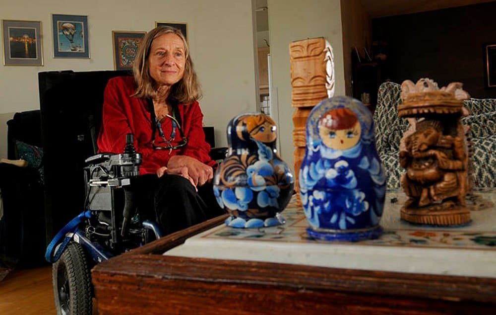 Linda McGowan has collected various trinkets from her travels around the world, including Russian Matryoshka dolls and tikis from Indonesia