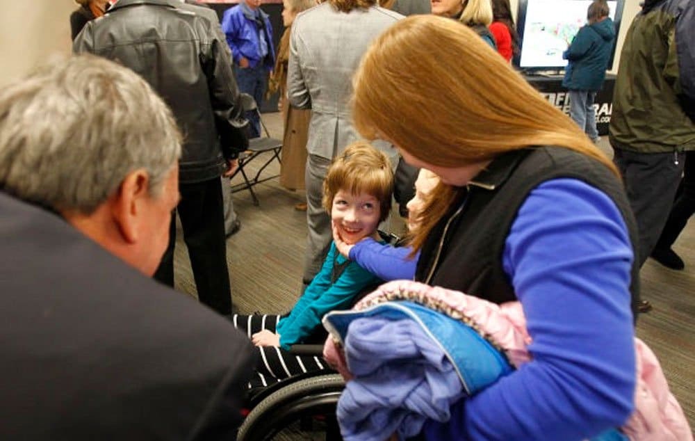 Hannah Miller, 8, smiles at her mother, Christine Miller, after First Federal Savings Bank unveiled plans to build a full-access park at the Sunway Soccer Complex