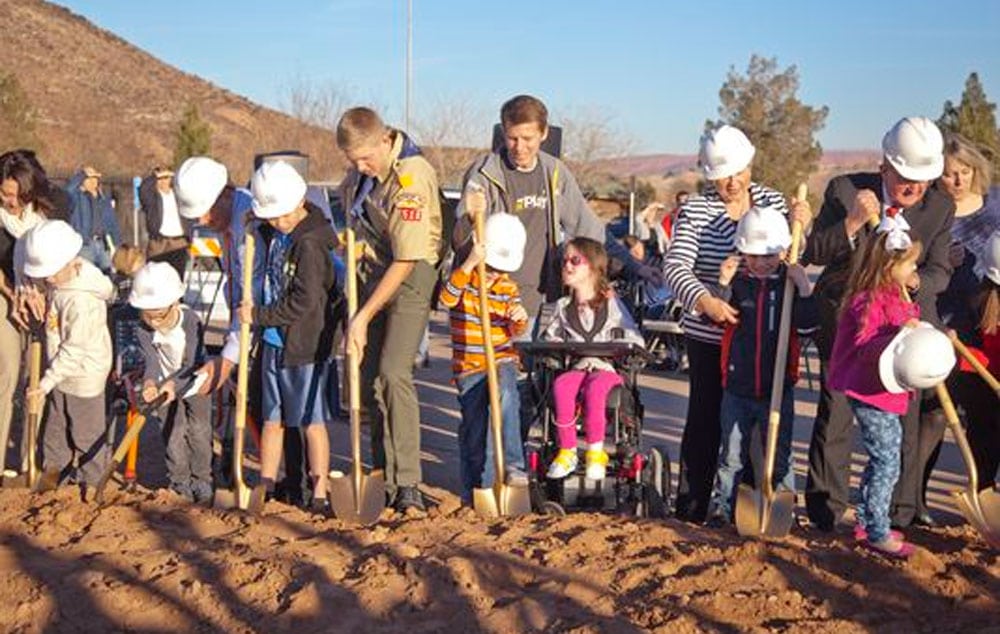 Members of the community, contributors and volunteers gather for the official groundbreaking of the all-abilities park in the Tonaquint Park complex