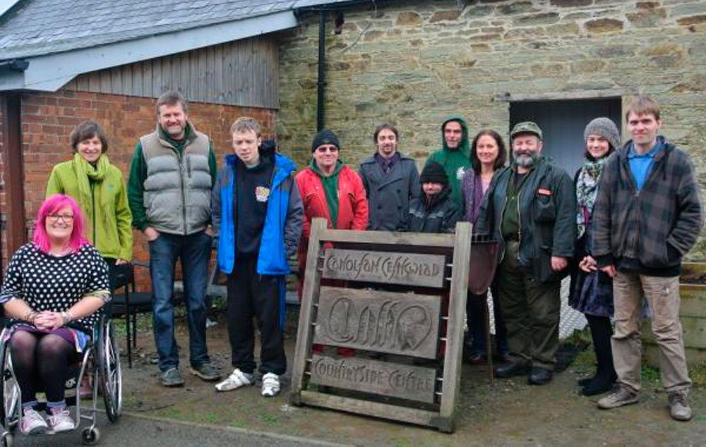 Travel writer and accessibility consultant Emily Yates is pictured with Liz Williams of Pembrokeshire Tourism, Jim Bowen of Clynfyw Care Farm and members of the Clynfyw team.