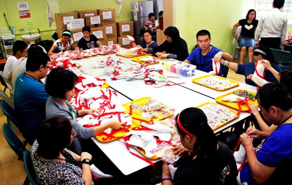 Special needs clients from MINDS packing Christmas items at its sheltered workshop.