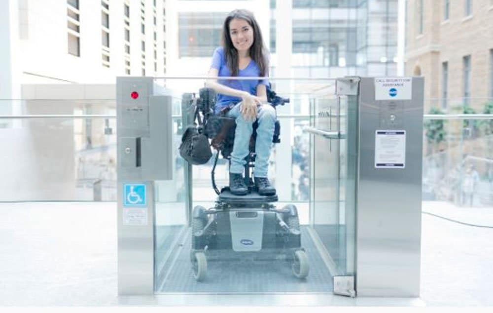 Accessibility advocate and entrepreneur Maayan Ziv uses a lift at Toronto's MaRS building