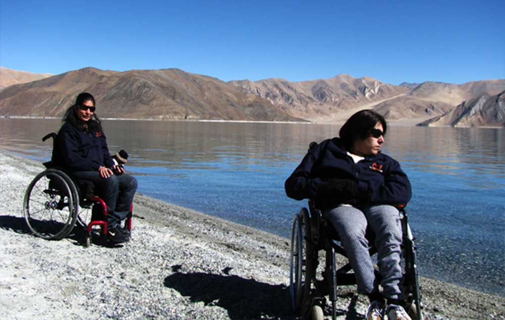 Tourists Sunita and Neenu enjoy a trip to Pangong Lake in Ladakh