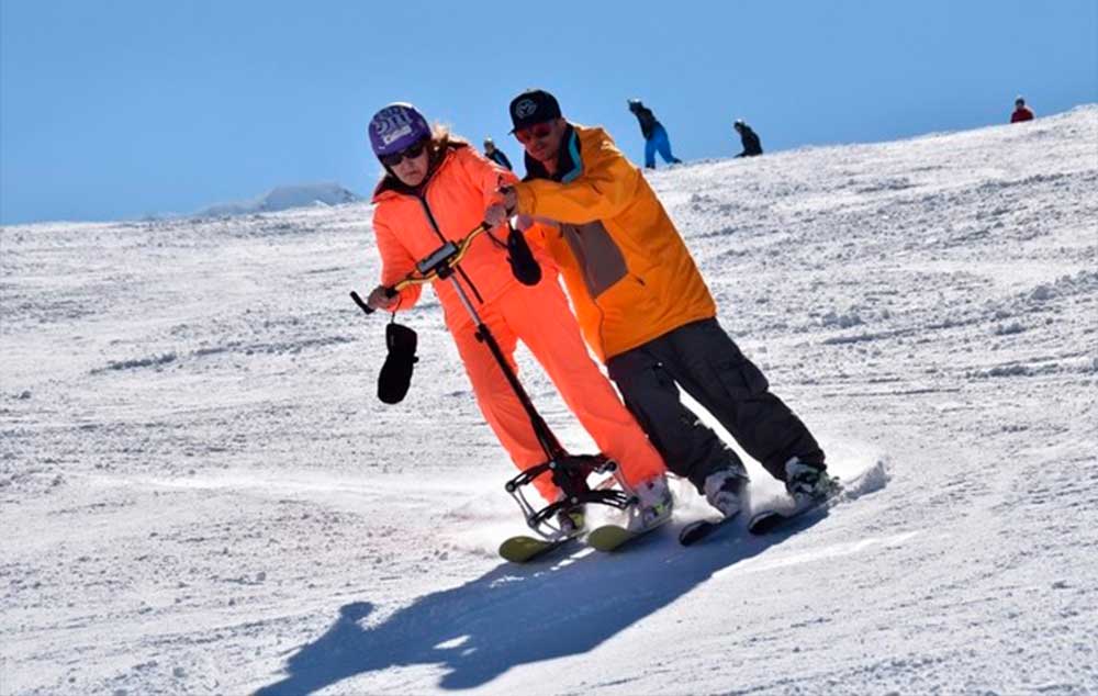 Medical supports allow disabled skiers to ski upright.