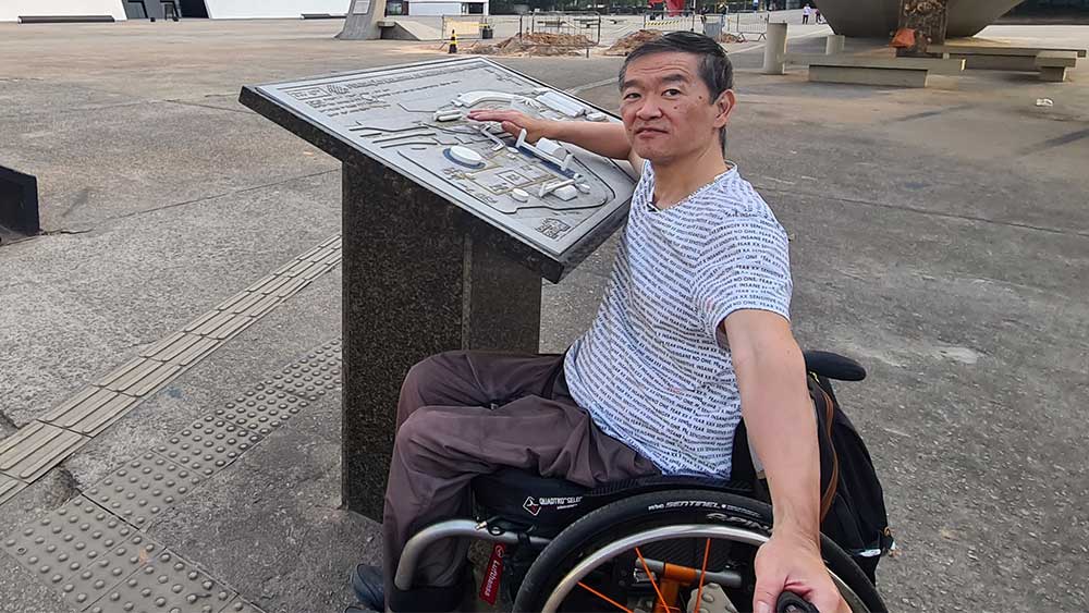 Man climbs CN Tower steps in wheelchair